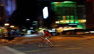 Person riding bicycle in Uptown Charlotte, NC