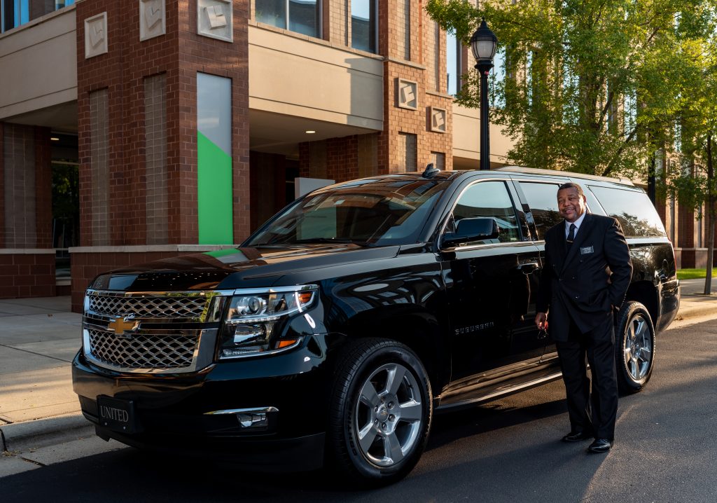 Driver with Chevrolet Suburban for limo in Charlotte